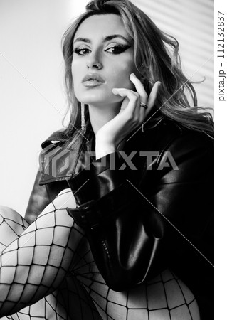 woman in leather coat woman in leather coat 112132837