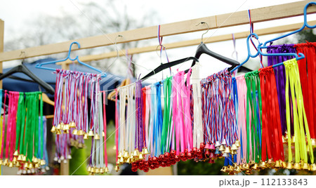 Vrbica orthodox holiday. Small bells, wreaths from willow branches and flowers selling near church. Kids and young girls wearing wreaths. 112133843