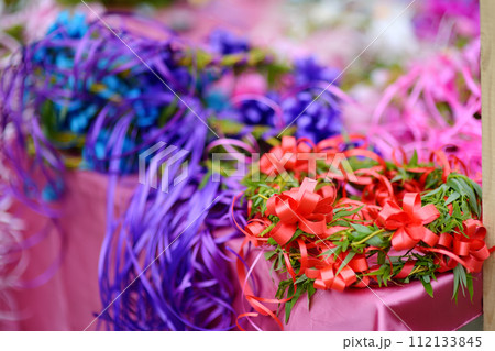 Vrbica orthodox holiday. Small bells, wreaths from willow branches and flowers selling near church. Kids and young girls wearing wreaths. 112133845