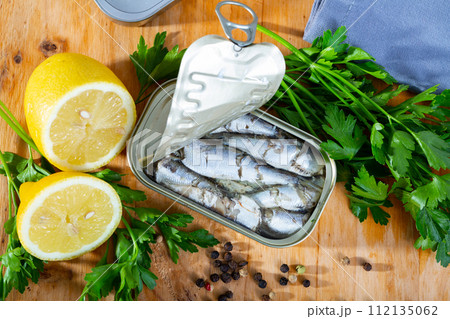 Open can of sardines on table Open can of sardines on table 112135062