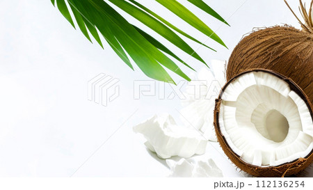 Coco. Coconut half and piece with leaves isolated on white background. Copy space, Banner with Coconut 112136254