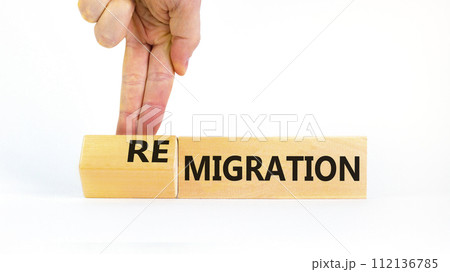 Migration or remigration symbol. Concept word Migration Remigration on beautiful wooden cubes. Beautiful white background. Businessman hand. Business migration or remigration concept. Copy space. Migration or remigration symbol. Concept word Migration Remigration on beautiful wooden cubes. Beautiful white background. Businessman hand. Business migration or remigration concept. Copy space. 112136785