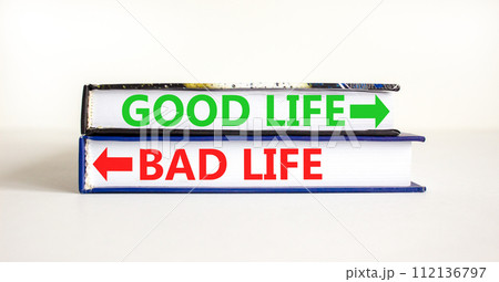 Good or bad life symbol. Concept word Good life Bad life on beautiful books. Beautiful white table white background. Business and Good or bad life concept. Copy space. 112136797