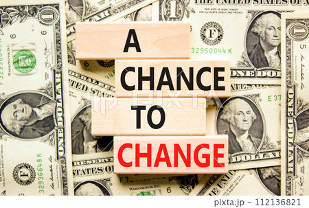 A chance for change symbol. Concept words A chance for change on beautiful wooden block. Beautiful dollar bills background. Dollar bills. Business A chance for change concept. Copy space. A chance for change symbol. Concept words A chance for change on beautiful wooden block. Beautiful dollar bills background. Dollar bills. Business A chance for change concept. Copy space. 112136821