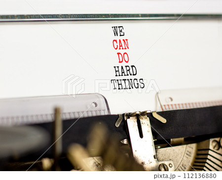 We can do hard things symbol. Concept words We can do hard things typed on beautiful old retro typewriter. Beautiful white background. Business, we can do hard things concept. Copy space. We can do hard things symbol. Concept words We can do hard things typed on beautiful old retro typewriter. Beautiful white background. Business, we can do hard things concept. Copy space. 112136880