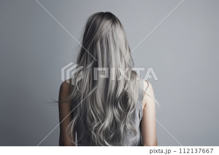 Rear view of a girl with flowing long gray hair, care and hair care concept 112137667