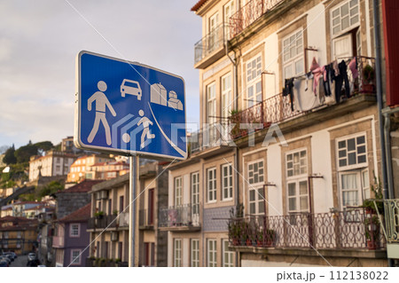 Home zone road sign in Porto, Protugal on old houses background Home zone road sign in Porto, Protugal on old houses background 112138022