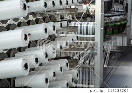 A range of equipment with spools of polypropylene threads. A range of equipment with spools of polypropylene threads. 112138203