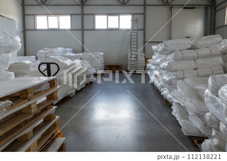 New white polypropylene bags are folded. New white polypropylene bags are folded. 112138221