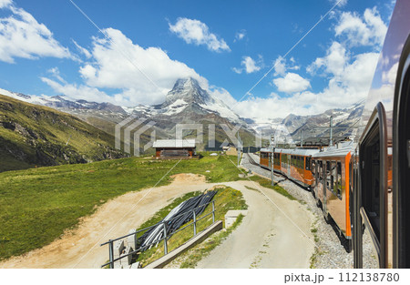train on the background of the Matterhorn mountain in the Swiss Alps 112138780