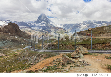 train on the background of the Matterhorn mountain in the Swiss Alps 112138984