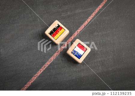 Germany vs France concept. Wooden blocks on a dark chalkboard background 112139235