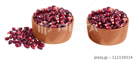 Purple corn seeds in wooden bowl isolated on white background with full depth of field Purple corn seeds in wooden bowl isolated on white background with full depth of field 112139314