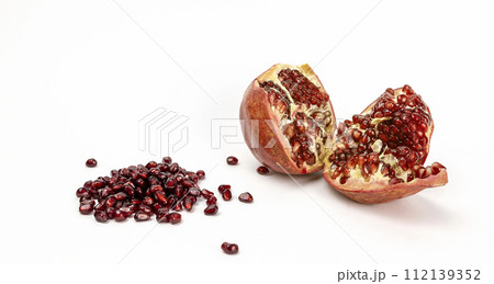 Pomegranate fruits. Pomegranate grain. Pomegranate cut in half on a white background. 112139352