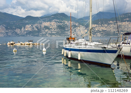 boats and promenade Malcesine on the shores of Lake Garda 112148269