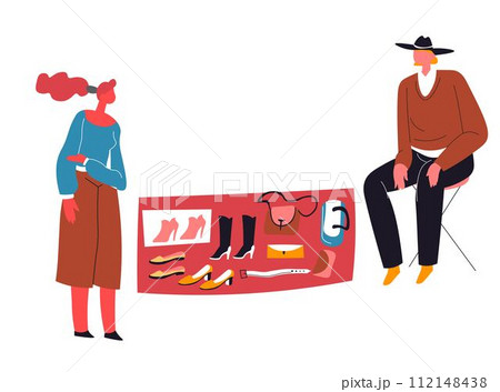 Man selling shoes and clothing on flea market 112148438