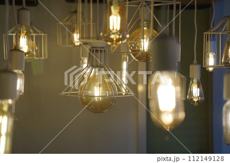 Antique style light bulbs hanging from the ceiling Antique style light bulbs hanging from the ceiling 112149128