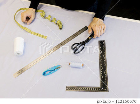 Male tailor working Male tailor working 112150670
