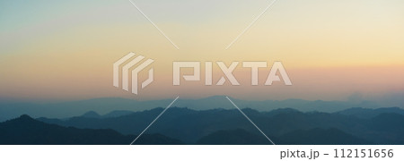 landscape and travel concept with panorama sunset and twilight sky with layer of mountain 112151656