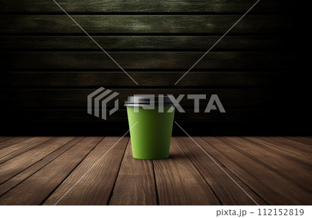 small cup containing a coffee drink on wooden table 112152819
