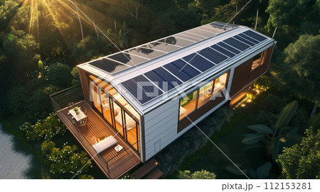 solar panels on a modern tiny house roof top solar panels on a modern tiny house roof top 112153281