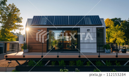 solar panels on a modern tiny house roof top solar panels on a modern tiny house roof top 112153284