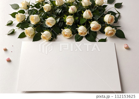 mockup blank postcard letter and bouquet of white roses on light background 112153625