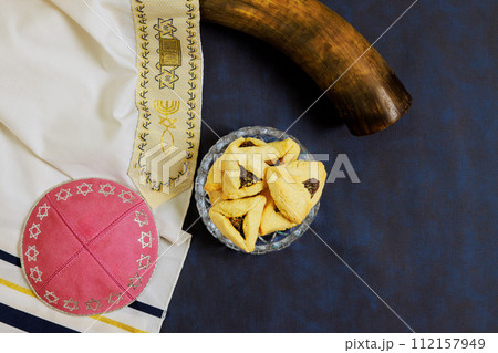 As symbol of celebration, Jewish holiday Purim is associated with rattles, carnival masks, hamantaschen cookies. As symbol of celebration, Jewish holiday Purim is associated with rattles, carnival masks, hamantaschen cookies. 112157949