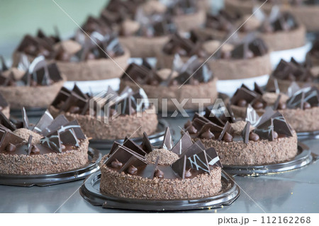 Industrial line of cakes. Many beautiful cakes on the table 112162268