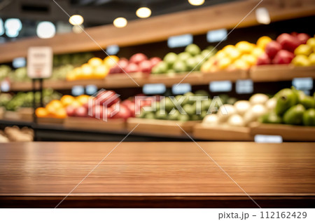 Empty table top with supermarket blurred defocused panorama, bokeh light. Backdrop for display or montage products. Blank wood textured counter with blur grocery, market store background. Front view 112162429