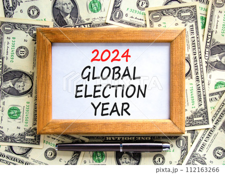 2024 global election year symbol. Concept words 2024 global election year on beautiful frame. Beautiful dollar bills background. Dollar bills. Business 2024 global election year concept. Copy space 2024 global election year symbol. Concept words 2024 global election year on beautiful frame. Beautiful dollar bills background. Dollar bills. Business 2024 global election year concept. Copy space 112163266