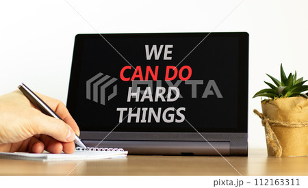 We can do hard things symbol. Concept words We can do hard things on beautiful black tablet. Beautiful white background. Businessman hand. Business, we can do hard things concept. Copy space. We can do hard things symbol. Concept words We can do hard things on beautiful black tablet. Beautiful white background. Businessman hand. Business, we can do hard things concept. Copy space. 112163311