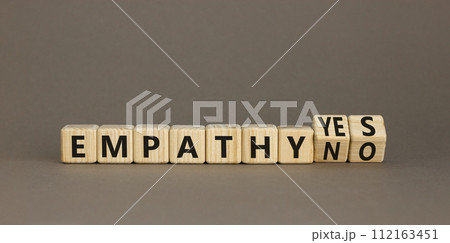 Empathy yes or no symbol. Concept words Empathy no to Empathy yes on beautiful wooden cubes. Beautiful grey table grey background. Psychological and empathy yes or no concept, copy space. Empathy yes or no symbol. Concept words Empathy no to Empathy yes on beautiful wooden cubes. Beautiful grey table grey background. Psychological and empathy yes or no concept, copy space. 112163451