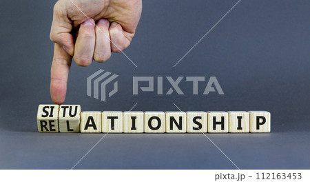 Relationship or situationship symbol. Concept word Relationship situationship on wooden cubes. Beautiful grey background. Businessman hand. Business relationship situationship concept. Copy space. Relationship or situationship symbol. Concept word Relationship situationship on wooden cubes. Beautiful grey background. Businessman hand. Business relationship situationship concept. Copy space. 112163453