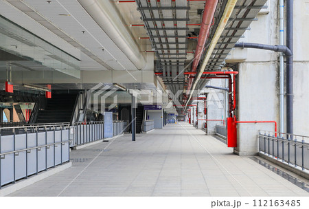 electrical steel pipeline, Electrical cable wire way on wall, cable routing between electrical distribution panel with equipment, industry construction concept. electrical steel pipeline, Electrical cable wire way on wall, cable routing between electrical distribution panel with equipment, industry construction concept. 112163485