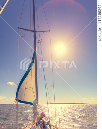 Yachting on sail boat during sunny weather 112166262