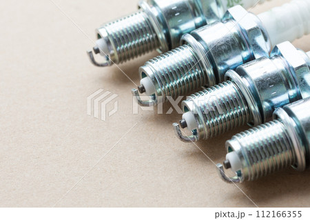Auto service. Set of spark plugs as spare part of car. 112166355