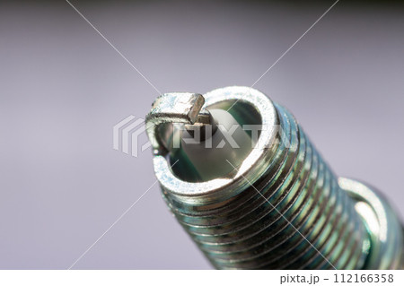 Auto service. New spark plug as spare part of car. 112166358