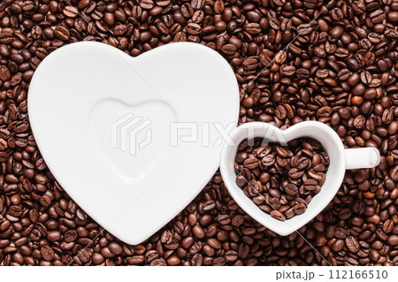 cup and saucer on coffee beans background 112166510
