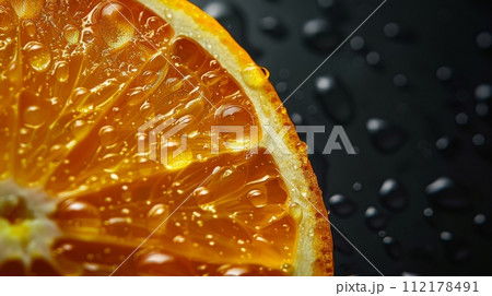 A macro shot capturing the vibrant texture and water drops on a fresh orange slice against a dark background. Hyper-realistic. 112178491
