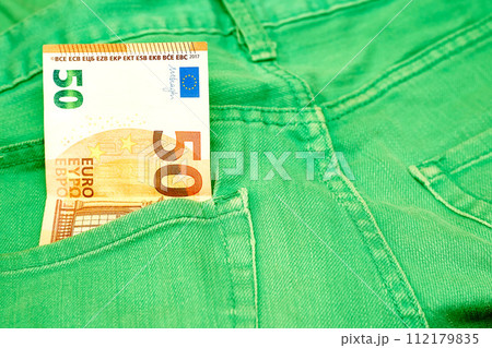 Money, shopping. 50 euro banknote in green jeans 112179835