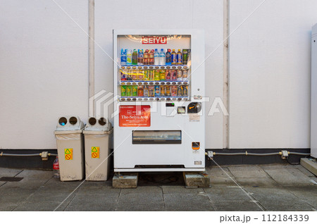 Tokyo, Japan -October  1  , 2023 :  Vending machines in Tokyo, Japan. Coca-Cola vending machine on a residential street 112184339