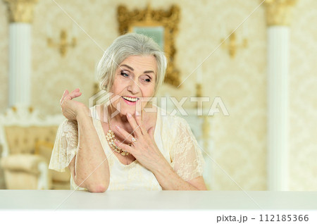 Portrait of beautiful happy senior woman posing Portrait of beautiful happy senior woman posing 112185366