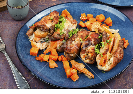 Meat roll with apples and sweet potatoes. 112185892