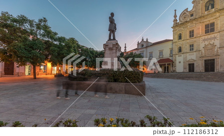 Panorama showing Sa da Bandeira Square with a view of the Santarem See Cathedral day to night timelapse. Portugal 112186312