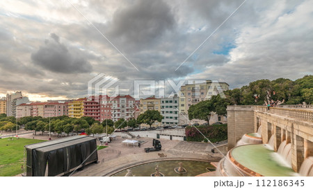 Panorama showing aerial view of Jardim da Alameda in Lisbon with the Luminous Fountain timelapse during sunset. 112186345