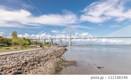 Panorama showing the Vasco da Gama Bridge timelapse in Lisbon, Portugal 112186346