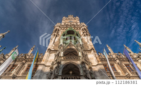 Clock Tower or Glockenspiel close-up, Detail of Rathaus New Town Hall with chime in city center timelapse, Munich, Germany. 112186381