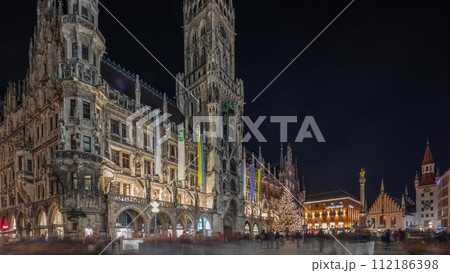 Marienplazt Old Town Square with Town Hall Clock Tower Glockenspiel night timelapse hyperlapse. 112186398