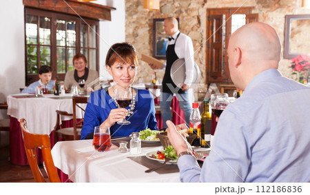 Adult couple at restaurant 112186836